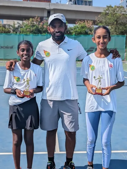 Our trainees Trisha Bhosale and Rumi Gadia with their coach after winning the U-12 doubles title together.