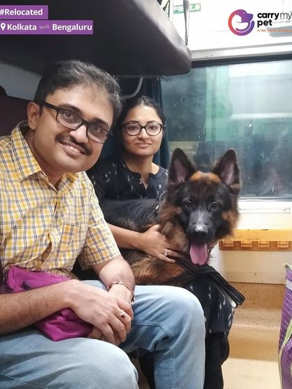 Abhra the German Shepherd poses with his family in their train coupe, ready for a new chapter in Bengaluru after moving from Kolkata. Train travel is a great option for domestic moves.