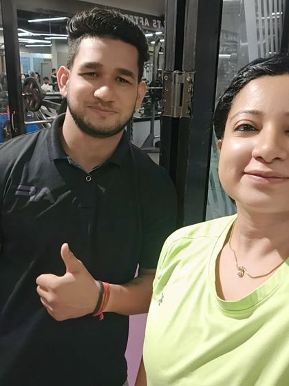A happy client with her trainer. Her message, "Thank you for making me an improved version of me," is the reason I do what I do.