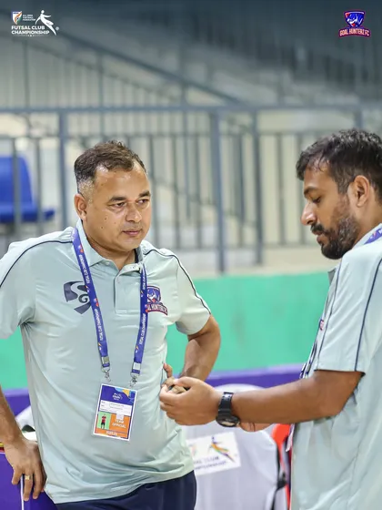 The brains behind the game. Our head coach and assistant coach discussing tactics.