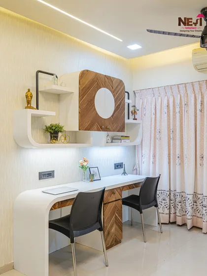 For a client who needed a workspace in their bedroom, I designed this dual workstation. It features a clean, modern look with curved edges, ample desk space for two, and overhead storage with integrated lighting.
