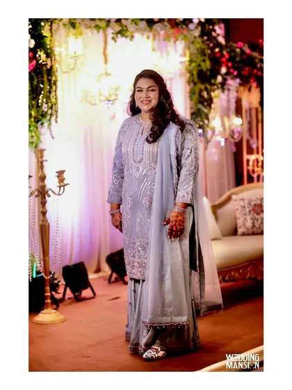 We are delighted to see our patrons adorn our creations for their special occasions. Here, our client wears a custom-tailored pure organza suit, showcasing the beauty of heavy Zardozi, sequins, and threadwork in a real-world setting.