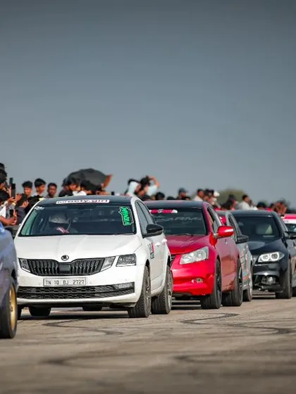 A long lineup of heavily modified cars ready to race. This showcases the depth of our participant pool and the serious level of competition at Vroom.