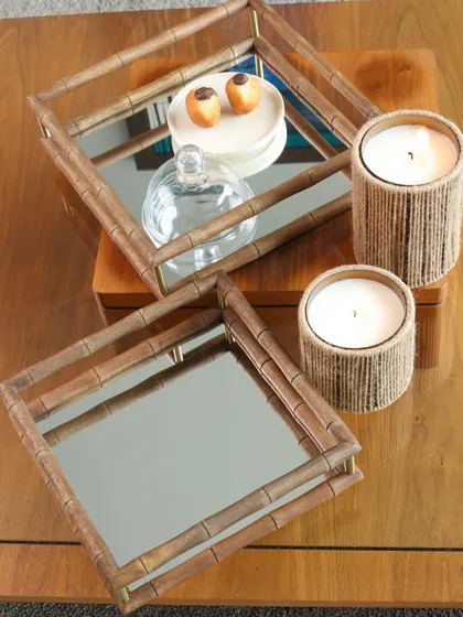 Our square bamboo-style mirror trays, shown here in a set of two. They are perfect for creating a sophisticated and organized display on a coffee table or bar cart.