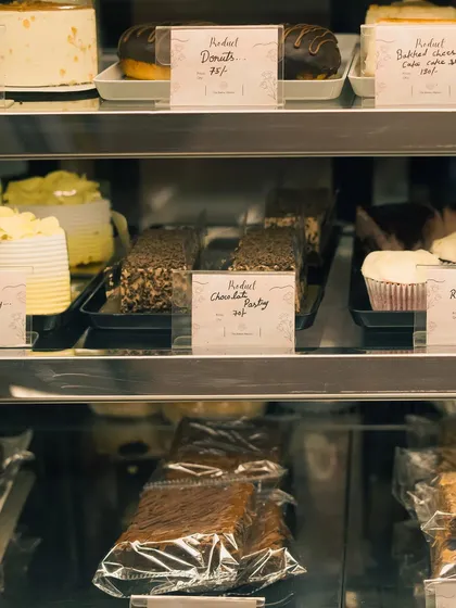 Another angle of the bakery display, showing the different pastries and their price tags. This gives a realistic glimpse into the bakery's offerings.