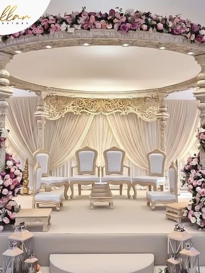 A semi-circular mandap design that is both modern and elegant. The structure is adorned with beautiful roses, creating a sophisticated and romantic space for the ceremony.
