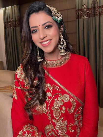 A happy client, her smile lighting up her face, her makeup looking timeless and elegant.