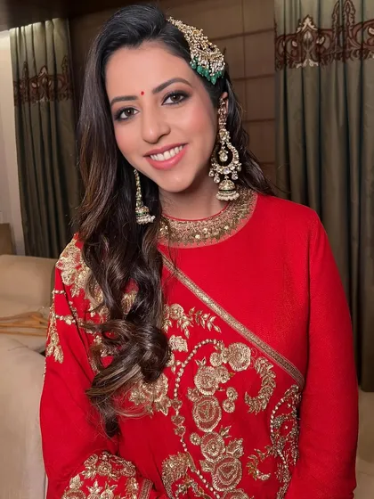 A happy client, her smile lighting up her face, her makeup looking timeless and elegant.