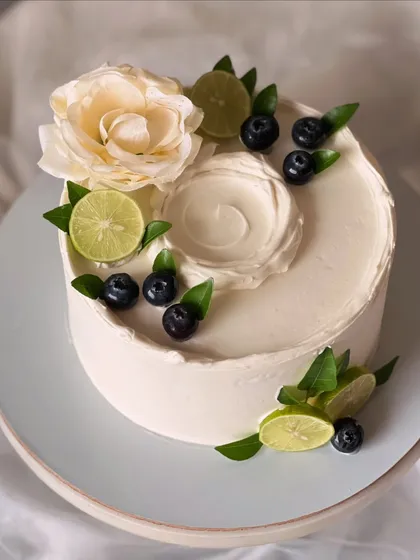 My most popular creation, the signature Italian Lemon & Blueberry cake. I offer many design variations, all featuring fresh blueberries, zesty lime, and smooth buttercream.