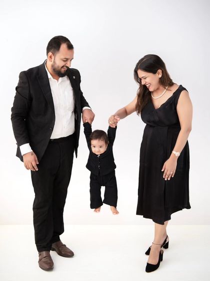 A fun and dynamic family photo. Swinging the little one between mom and dad always brings out the biggest smiles and genuine laughter.