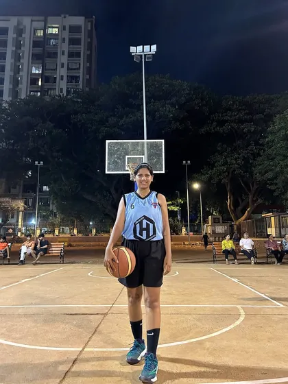 The captain of the Hoop Hustlers, a star player who leads her team with skill and determination.