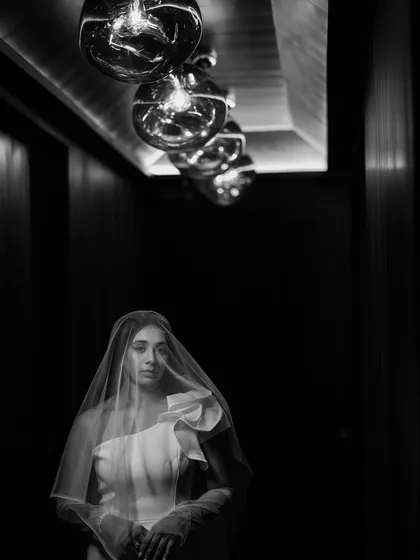 Some moments possess a timeless elegance that color cannot capture. This artistic black and white portrait of Ashmita, shrouded in her veil, focuses on emotion and form, creating a powerful and sophisticated image that feels eternal.