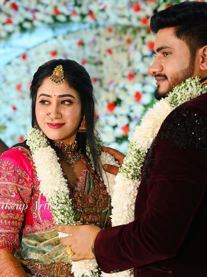 Another beautiful moment between the couple. The bride's makeup is designed to be picture perfect from every angle.