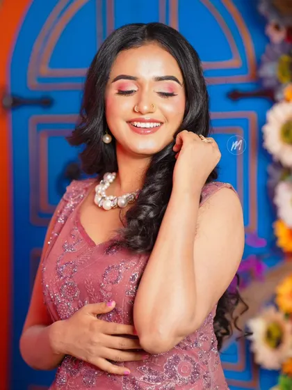 The model with her eyes closed, highlighting the soft, blended eyeshadow.