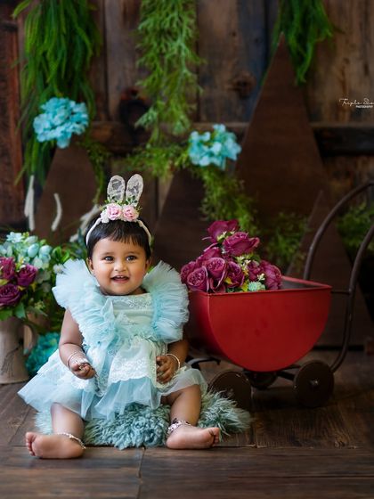 A happy smile from the birthday girl in her bunny-themed sitter session. This is a perfect way to celebrate a milestone before they turn one.