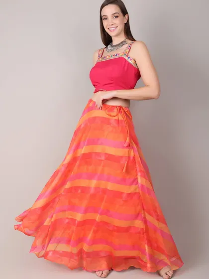 This elegant orange and pink striped lehenga is perfect for festive evenings and graceful dandiya nights. The lightweight fabric and bright colors blend tradition with modern sophistication.