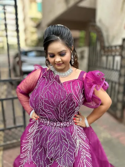 A candid shot from the demonstration, showing the beautiful details of the gown and the flawless makeup.