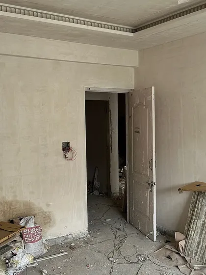 Before: A bedroom in our 'Modern Muse' project, stripped down to its basics at the start of the renovation.
