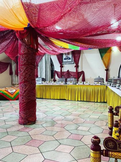 Another view of the Rajasthani-themed decor, showing the full buffet line and a traditional swing (jhoola). I work to create an immersive experience that complements the celebration.