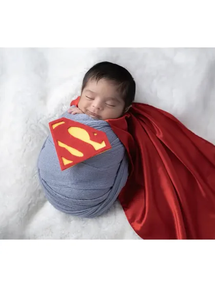 Your little one is already a superhero in your eyes, and we can create a fun photoshoot to match. This custom Superman theme shows how we can play with creative ideas to capture your baby's budding personality in a unique and memorable way.