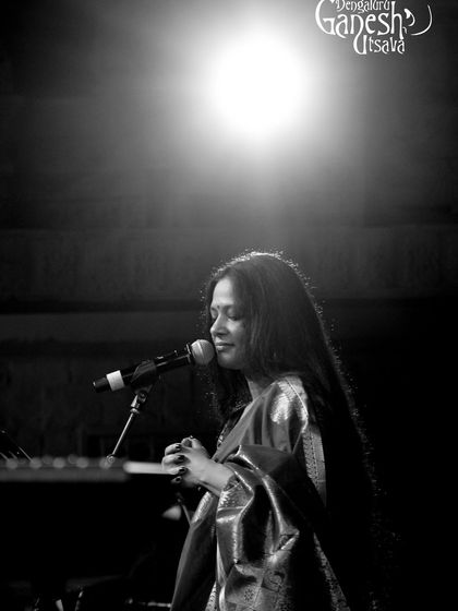 An artistic shot from the Bengaluru Ganesh Utsava. The single light feels like a spotlight on the music itself, a reminder of the focus and dedication that goes into every performance.