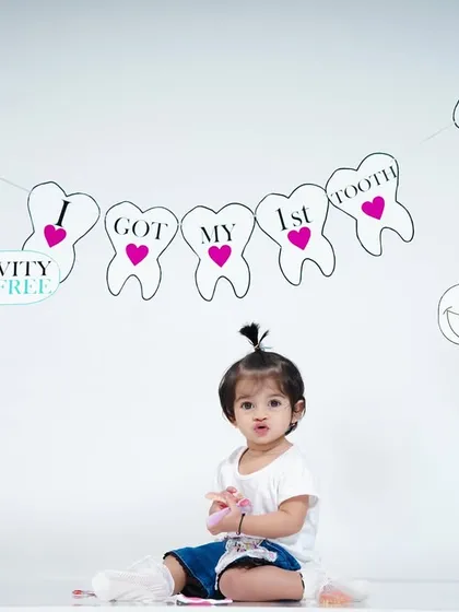 A cute and simple setup to announce the arrival of that very first tooth.