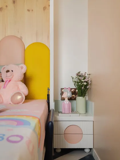 A cute detail from the kids' room, showcasing the custom nightstand and colorful headboard.