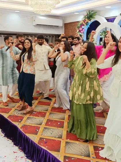 The friends and family getting up on stage for a spontaneous dance performance.