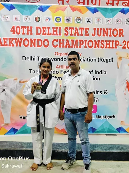 With Vanshika Singhal after she won gold at the 40th Delhi State Junior Taekwondo Championship 2024. This victory qualified her for the Junior Nationals in Aurangabad.