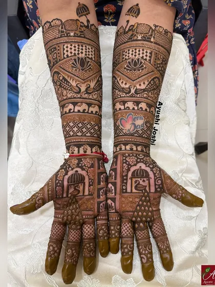 This design is not for a bride, but it's every bit as royal. It's adorned with peacocks, elephants, and blooming lotuses, perfect for the bride's sister or close family.
