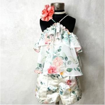 This floral holiday set is perfect for a warm-weather getaway, combining a breezy, ruffled top with comfortable and stylish printed shorts.