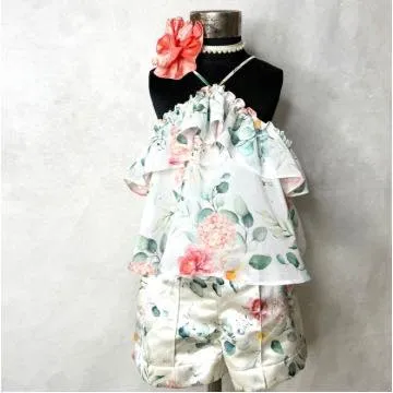 This floral holiday set is perfect for a warm-weather getaway, combining a breezy, ruffled top with comfortable and stylish printed shorts.