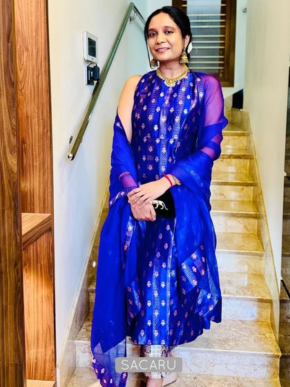 Our client Pallavi looking glamorous in her customized royal blue brocade Indo-western kurta and pant set.