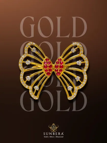 This exquisite butterfly piece, crafted in gold with ruby and diamond accents, is a versatile design. While perfect as a centerpiece for a luxurious rakhi, it can also be used as a brooch or a pendant, making it a gift that keeps on giving.