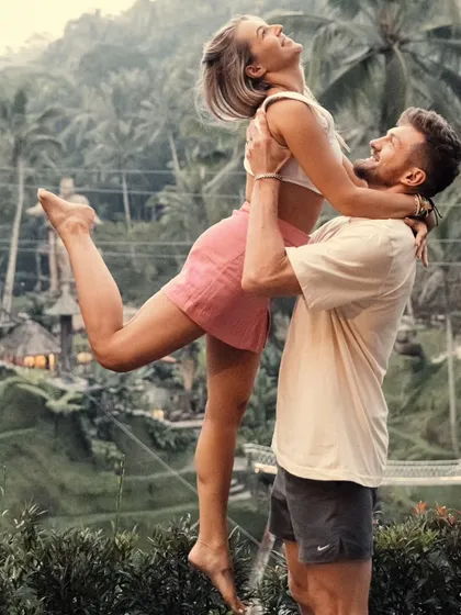 Pure happiness, framed by the lush green rice terraces of Ubud, Bali. This shot is all about capturing the couple's playful connection in an exotic location. It shows our passion for traveling the world to find the perfect backdrop for your love story.