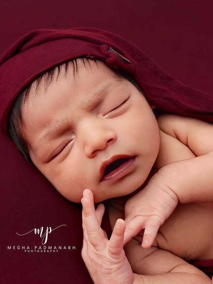 A tiny yawn captured mid-moment. These are the authentic, unscripted details we aim to preserve from your baby's first days.