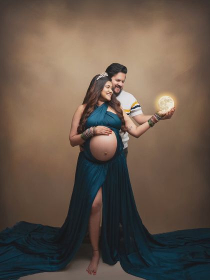 In this magical moment, we captured the pure joy and anticipation of this couple as they hold a glowing moon, awaiting their little moonbeam.