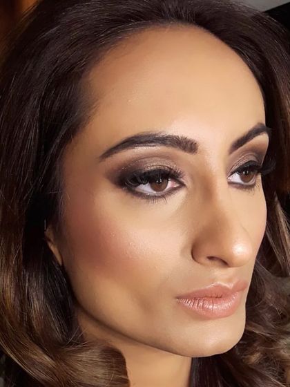 Another angle of this glamorous smokey eye makeup. It shows how the look catches the light and defines the eyes, making it a perfect choice for wedding festivities.