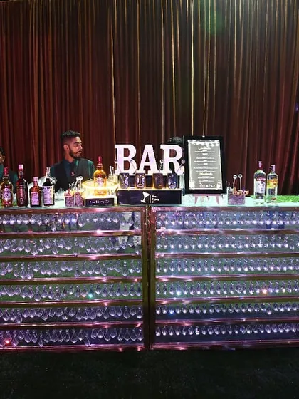 For grand celebrations, we deliver a bar to match. This setup features a fully stocked, LED-illuminated bar, ready to serve hundreds of guests with speed and style, making it a stunning centerpiece for any large wedding or corporate event.