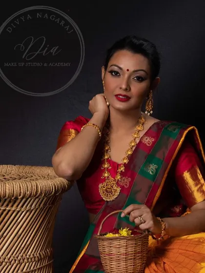 A beautiful portrait capturing the festive spirit. Her traditional attire and glowing makeup make her look radiant and ready for any celebration.