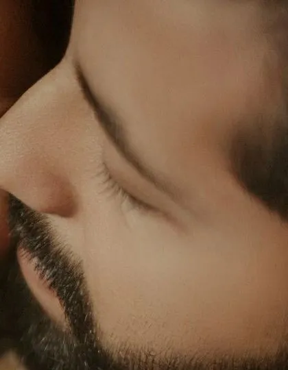 A macro shot capturing the intimate detail of a gentle touch. It's these small, often unnoticed gestures that tell the biggest stories about a couple's connection.