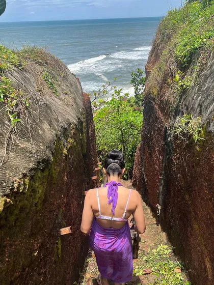 Exploring a natural stone pathway down to the ocean. My fitness journey ensures I have the stamina for beautiful hikes and discoveries.