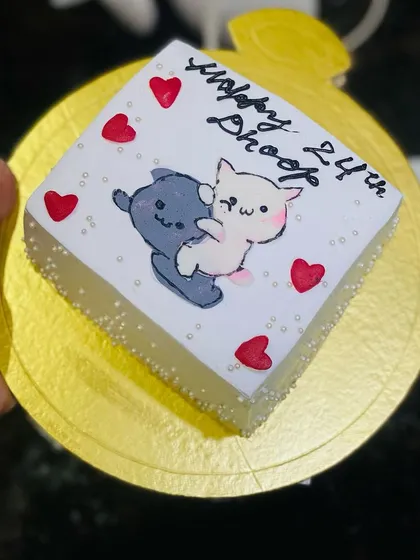 A cute mini cake with two cats cuddling, perfect for a special someone.