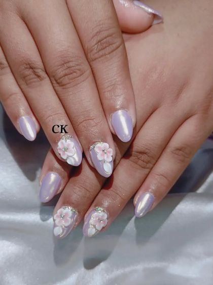 A beautiful lavender chrome set with delicate 3D pink and white flowers.