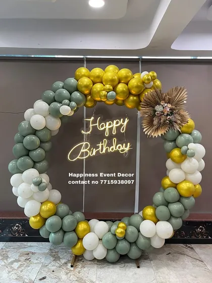 I can use different color palettes and materials to match your theme. This balloon ring features a modern mix of sage green, white, and gold balloons, accented with dried pampas grass for a rustic touch.