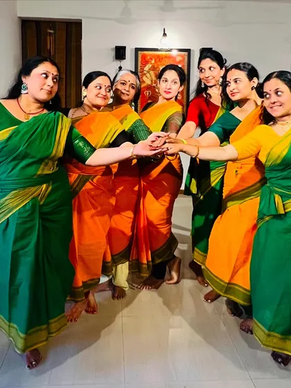 The dancers connect hands, symbolizing the unity and shared passion that binds our Samarpana family together.