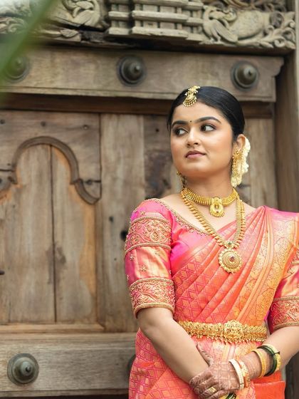 This bride is ready for her wedding ceremony. I created a classic look with a neat updo, traditional jewelry, and flawless HD makeup that enhances her natural beauty.
