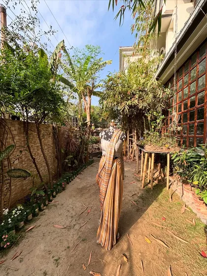 This saree looks at home in a natural, rustic setting. It's for the woman who appreciates simplicity and elegance.