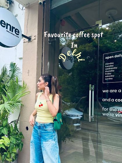 Another shot of my coffee spot outfit. The high ponytail and green bag add some fun to the look.