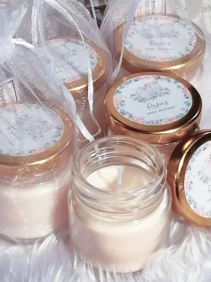 Another beautiful example of our customized return favors. These mini candles have a floral label and are packed in sheer white potlis.